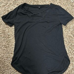 Women’s black tee with cross in front and slits in back